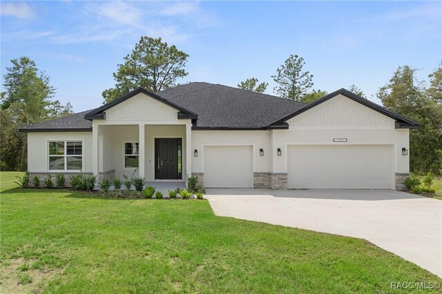 43 Bells Of Ireland Ct, Homosassa, FL 34446 - view of front of home featuring an attached garage, driveway, stone siding, a front yard, and a shingled roof
