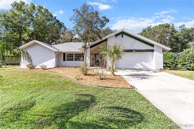 ranch-style home with a garage and a front yard