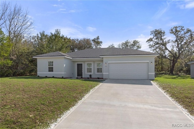 ranch-style house featuring a front yard and a garage