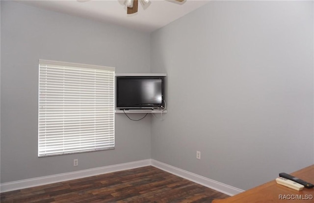 unfurnished room with dark wood-type flooring