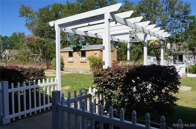 view of yard with an outbuilding and a pergola