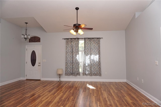 entryway featuring dark hardwood / wood-style flooring and ceiling fan with notable chandelier