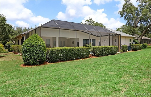 270 E Keller Ct, Hernando, FL 34442 - back of house with a lawn, ceiling fan, and glass enclosure