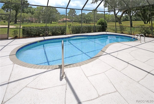 270 E Keller Ct, Hernando, FL 34442 - outdoor pool with glass enclosure, a patio area, and view of wooded area