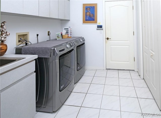 270 E Keller Ct, Hernando, FL 34442 - laundry room with cabinet space, washing machine and clothes dryer, and light tile patterned floors
