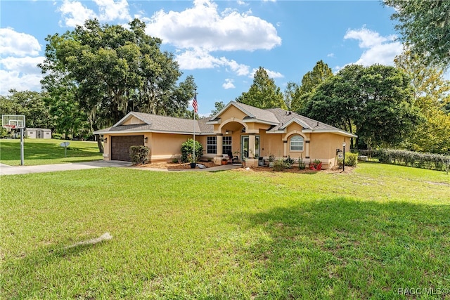 ranch-style home featuring a front yard and a garage