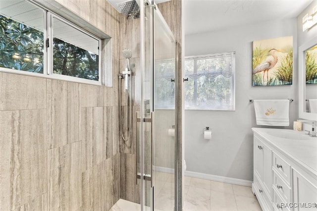 bathroom with tile patterned flooring, vanity, and a shower with shower door