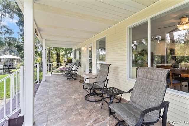 view of patio featuring a porch