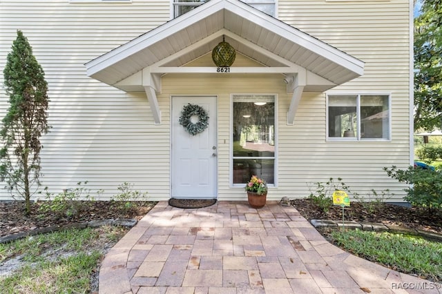 property entrance featuring a patio