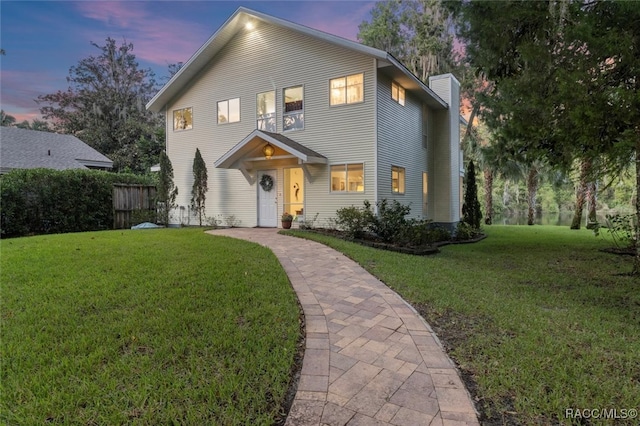 view of property featuring a lawn