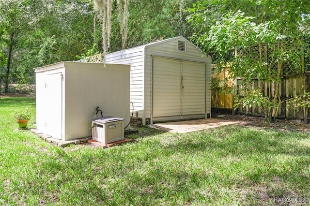 view of outbuilding featuring a lawn