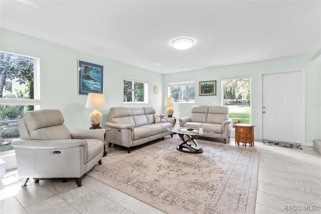 living room featuring plenty of natural light