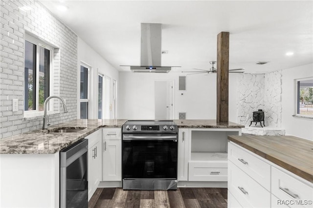 kitchen featuring white cabinets, appliances with stainless steel finishes, sink, and island range hood