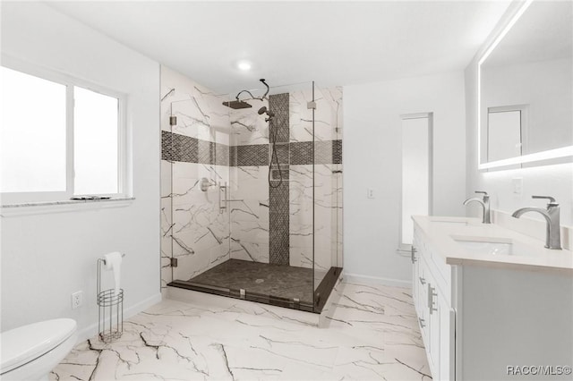 bathroom featuring an enclosed shower, vanity, and toilet