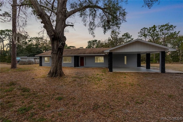 ranch-style house with a carport