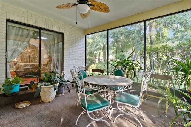 sunroom / solarium with ceiling fan