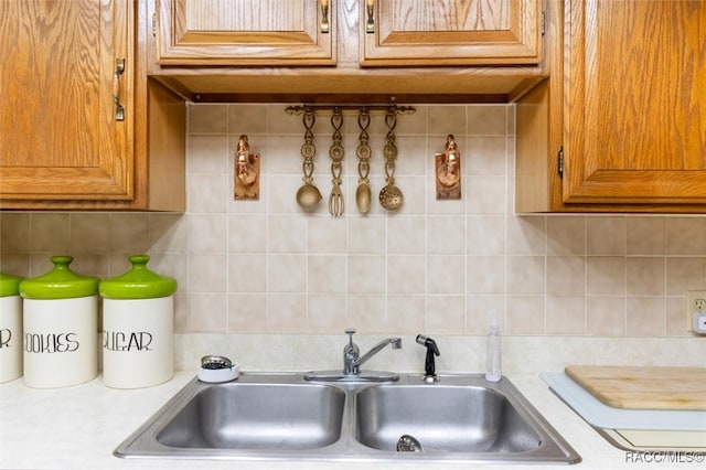 kitchen featuring backsplash and sink