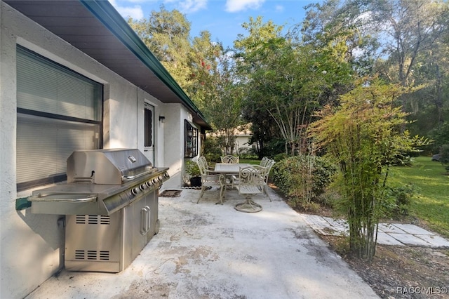 view of patio featuring a grill