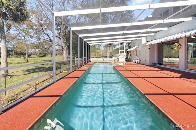 pool with a lanai and a patio