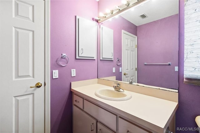 bathroom featuring vanity and visible vents