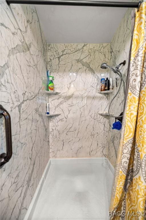 22535 SW 117th St, Dunnellon, FL 34431 - full bathroom featuring a marble finish shower