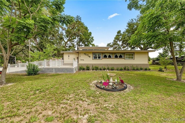 22535 SW 117th St, Dunnellon, FL 34431 - rear view of house with brick siding, a wooden deck, and a yard