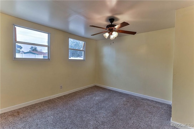 empty room featuring ceiling fan and carpet flooring