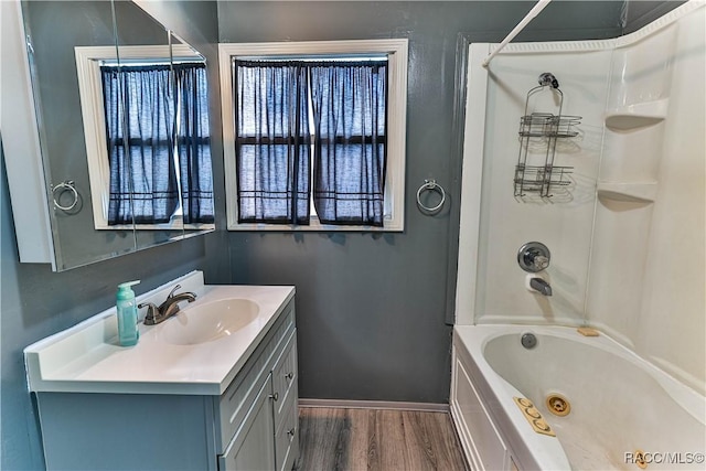 bathroom with vanity, shower / tub combination, and hardwood / wood-style floors