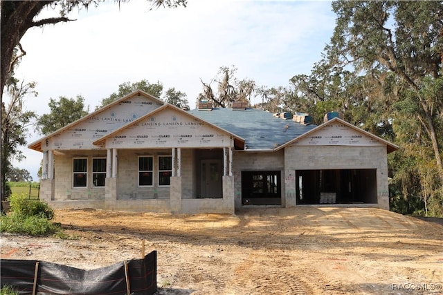 property in mid-construction with a garage