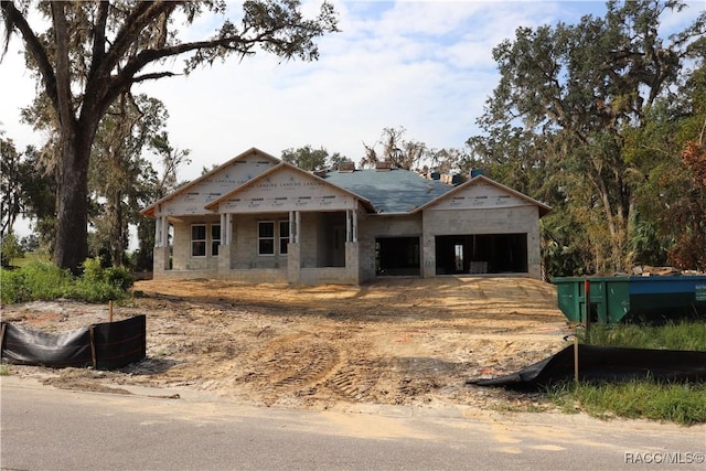 unfinished property with a garage