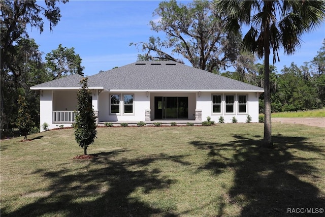 6392 Summit View Dr, Brooksville, FL 34604 - rear view of property featuring stucco siding, a lawn, and a shingled roof