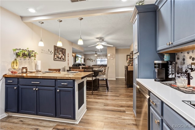 kitchen with dishwasher, butcher block counters, blue cabinetry, and light hardwood / wood-style flooring