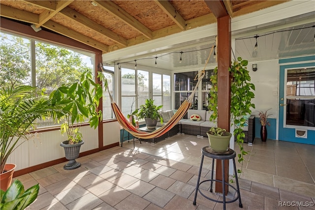 unfurnished sunroom with vaulted ceiling