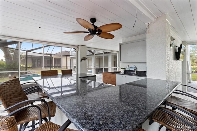 view of patio with an outdoor wet bar