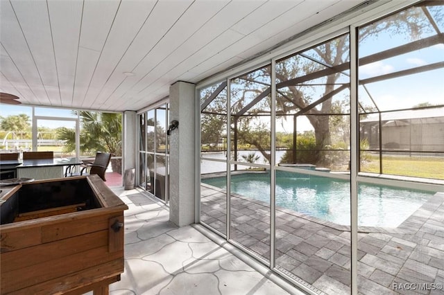 view of pool with a lanai and a patio area