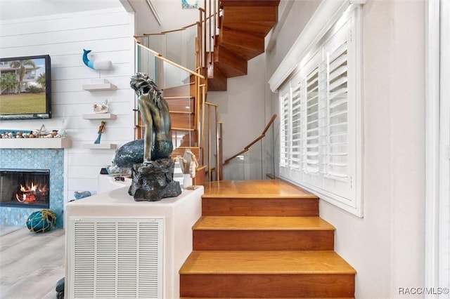 staircase with wooden walls