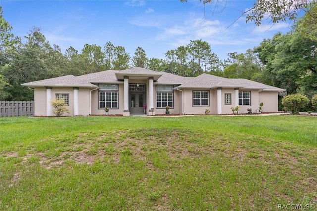 prairie-style home featuring a front yard