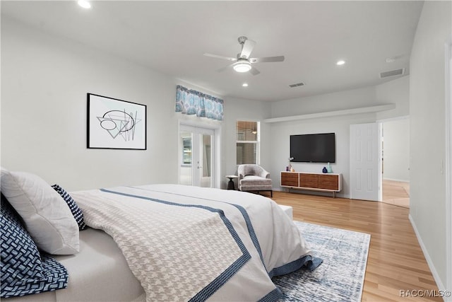 bedroom featuring hardwood / wood-style flooring and ceiling fan