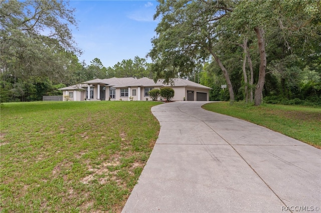 ranch-style house with a garage and a front lawn