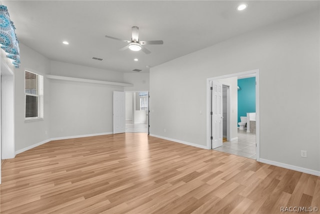 spare room with light hardwood / wood-style flooring and ceiling fan