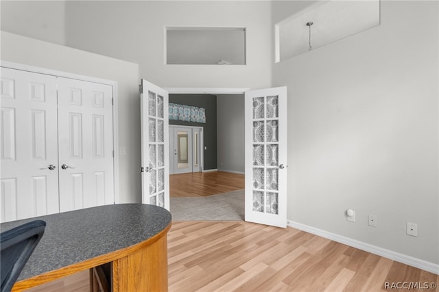 office area featuring hardwood / wood-style flooring and french doors