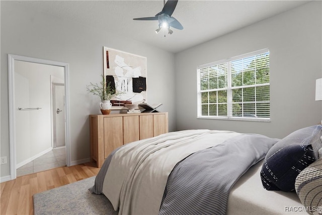 bedroom with wood-type flooring and ceiling fan