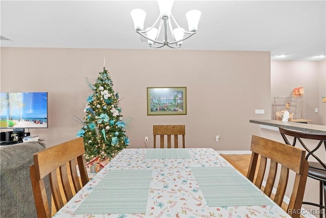 dining area with a notable chandelier