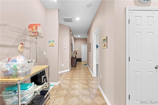 hallway featuring light tile patterned floors