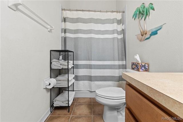 bathroom with a shower with shower curtain, tile patterned floors, vanity, and toilet