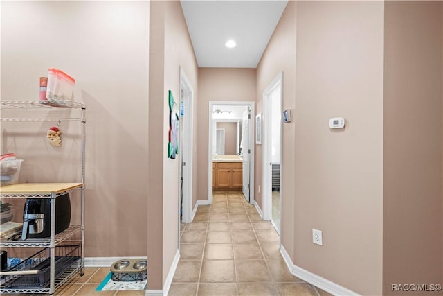 hallway featuring light tile patterned floors