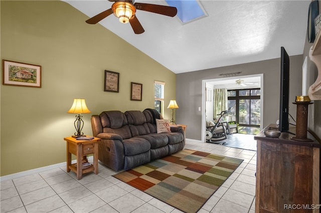 living room featuring ceiling fan, light tile patterned floors, and high vaulted ceiling