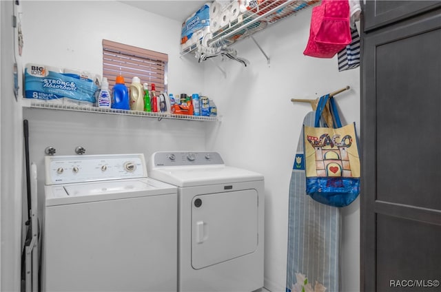 laundry area with separate washer and dryer