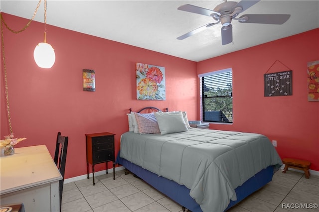 tiled bedroom with ceiling fan