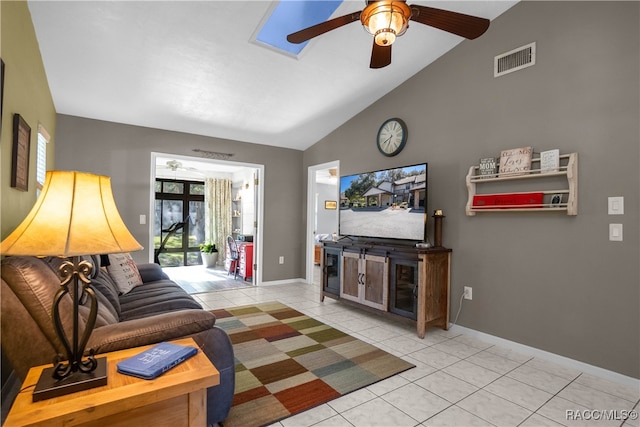 living room with light tile patterned floors, high vaulted ceiling, and ceiling fan